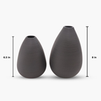 Two gray textured vases with measurements on a white background
