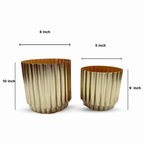 Two metallic planters with dimensions indicated on a white background